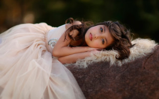 Young girl white dress lying - a photo free wallpaper