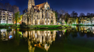 Gothic building tower reflection night - a reflection of the building free wallpaper