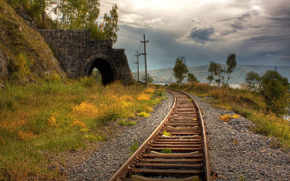 Train tunnel cloudy sky cityscape - evgeny lushpin free wallpaper