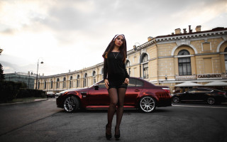 Woman black dress red car 3 - a building in the background free wallpaper