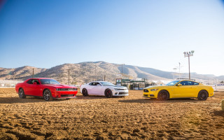 Three cars mountains blue sky - promotional image free wallpaper