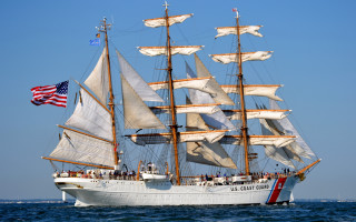White boat sails ocean flag - a large white boat free wallpaper