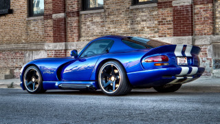 Blue sports car brick building 2 - shiny free wallpaper