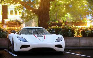 White sports car parking lot 17 - a tree and a building free wallpaper