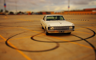 White car parking lot sunset 4 - tilt shift free wallpaper