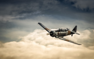 Small airplane cloudy sky dusk - dieselpunk free wallpaper