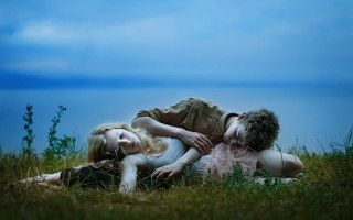 Dreamlike people laying grass lake - two person free wallpaper