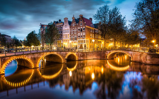 Bridge river lit building night 2 - a bridge over a river free wallpaper