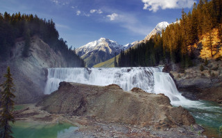 Waterfall mountain lake forest sky - a mountain in the background and a body of water free wallpaper