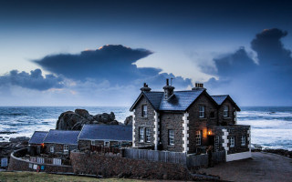 House rocky shore cloudy sky - rich moody colour free wallpaper