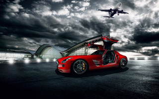 Red sportscar jet plane cloudy - a red sports car free wallpaper