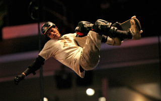 Skateboard trick man white shirt - a skateboard in the air free wallpaper