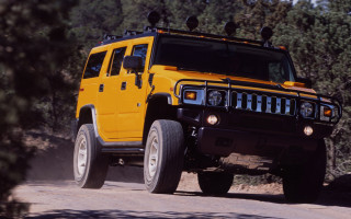 Yellow hummer dirt road woods - hypermaximalist free wallpaper