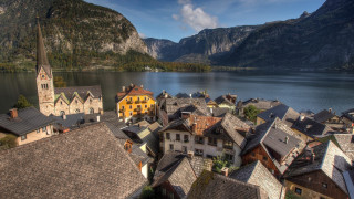 Village church mountains lake tiltshift - a lake in the foreground free wallpaper