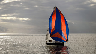 Sailboat blue orange sail cloudy - a sailboat free wallpaper