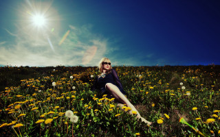 Woman sitting flower field sun - naturalism free wallpaper