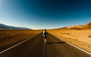Man walking mountains beach sunset - amir zand free wallpaper