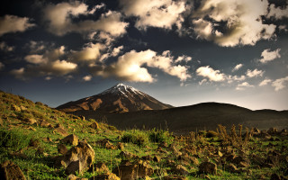 Mountain snowcap cloudy sky forest - peak in the distance free wallpaper