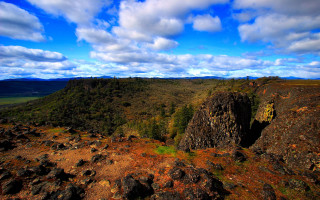 Rocky cliff blue sky clouds - a rocky cliff free wallpaper