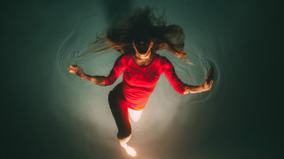 Woman floating water red shirt - elsa bleda free wallpaper