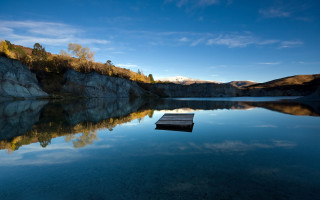 Lake mountain boat sky city - a mountain range in the distance free wallpaper