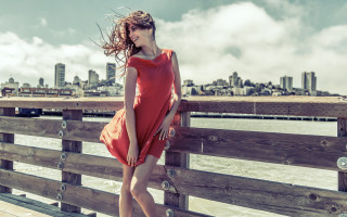 Woman red dress fence water - near free wallpaper