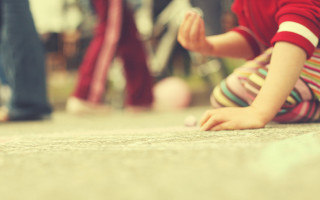 Little girl sitting crossed legs - a little girl free wallpaper