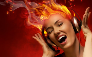 Fire haired woman laughing breathing - headphone free wallpaper