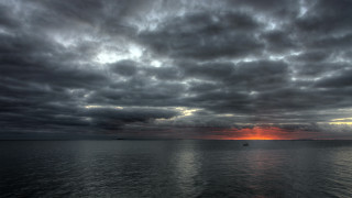 Sunset boat water cloudy sky 2 - a cloudy sky above free wallpaper
