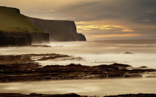 Rocky beach cliff water cloudy 2 - a rocky beach free wallpaper
