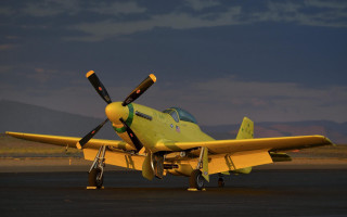 Yellow airplane runway mountains dusk - a runway free wallpaper