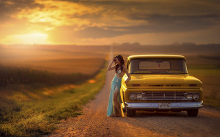 Woman dress yellow truck dusk - a field in the background free wallpaper