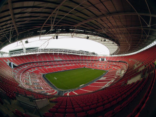 Stadium green field red seats 3 - a stadium free wallpaper