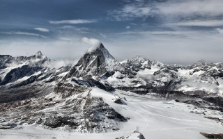 Snowy mountains cloudy horizon beach - mountain in the background free wallpaper