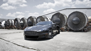 Black car jet engines parking 2 - a building in the background free wallpaper