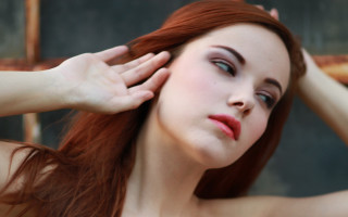 Red haired woman holding head - daphne mcclure free wallpaper