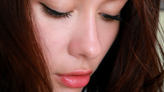 Woman longlashes pinklipstick phone closeup - facial feature free wallpaper
