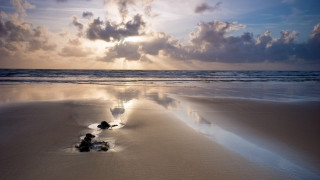 Beach rocks clouds sunset horizon - crepuscular ray free wallpaper