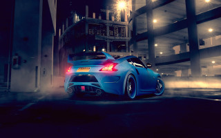 Blue car tall building night - a tall building free wallpaper