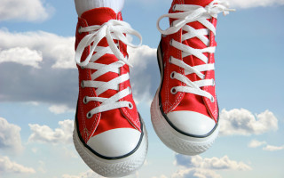 Red converse shoes jumping blue - kitsch movement free wallpaper