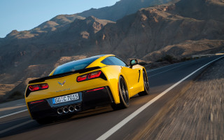 Yellow sports car mountains blue - feature free wallpaper