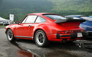 Red porsche parking lot mountains - a parking lot next free wallpaper
