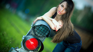 Woman leaning trafficlight grass field - a green field free wallpaper