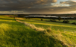 Grassy field river clouds evening - a grassy field free wallpaper