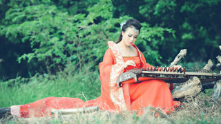 Woman red dress playing guitar - musical free wallpaper