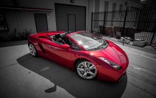 Red sports car parking lot 42 - a gate free wallpaper
