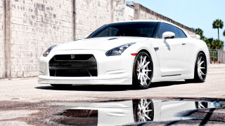 White sports car brick wall - the ground in front free wallpaper