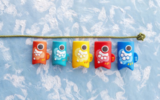 Colorful toothbrushes hanging blue clouds - a line free wallpaper