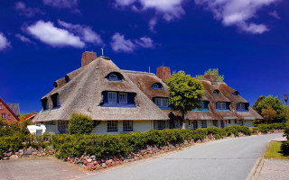 Thatched house blue sky castle - art free wallpaper
