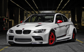 White car red rims parking - a parking garage free wallpaper